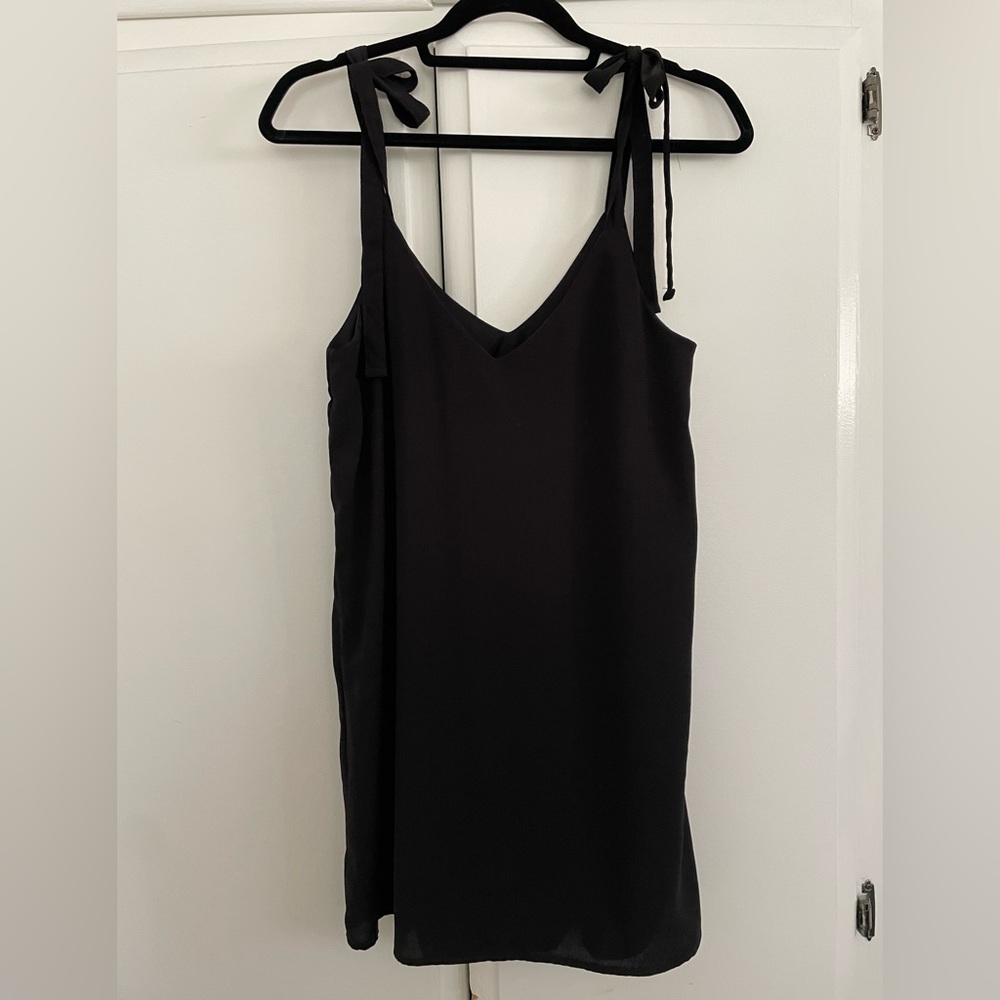 Classic black dress with straps. Size medium